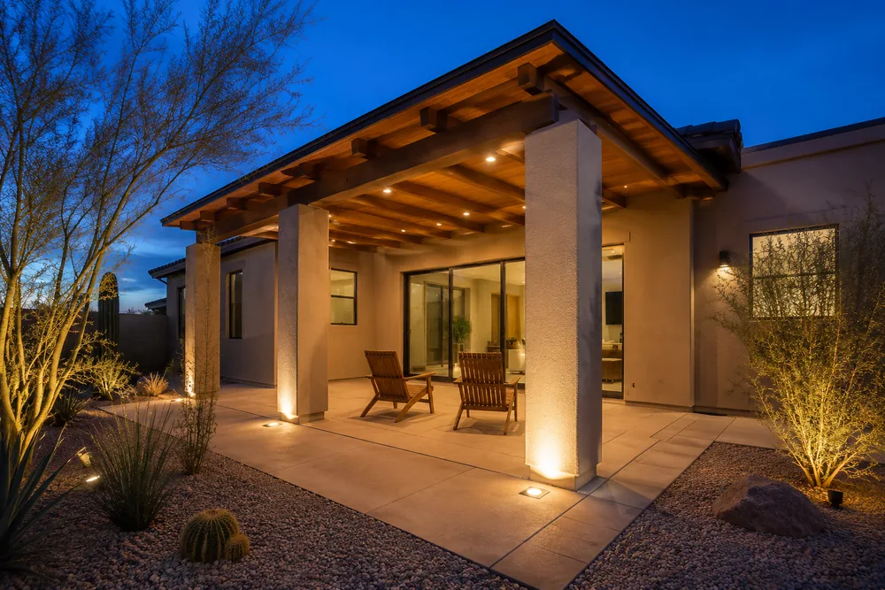 The same patio at dusk with the recessed lighting on